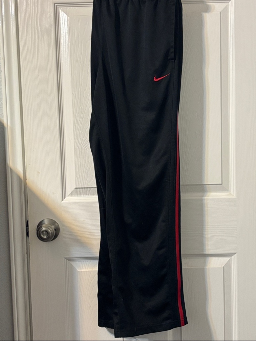 Nike Black Track Pants with Red Swoosh and Red Side Stripe